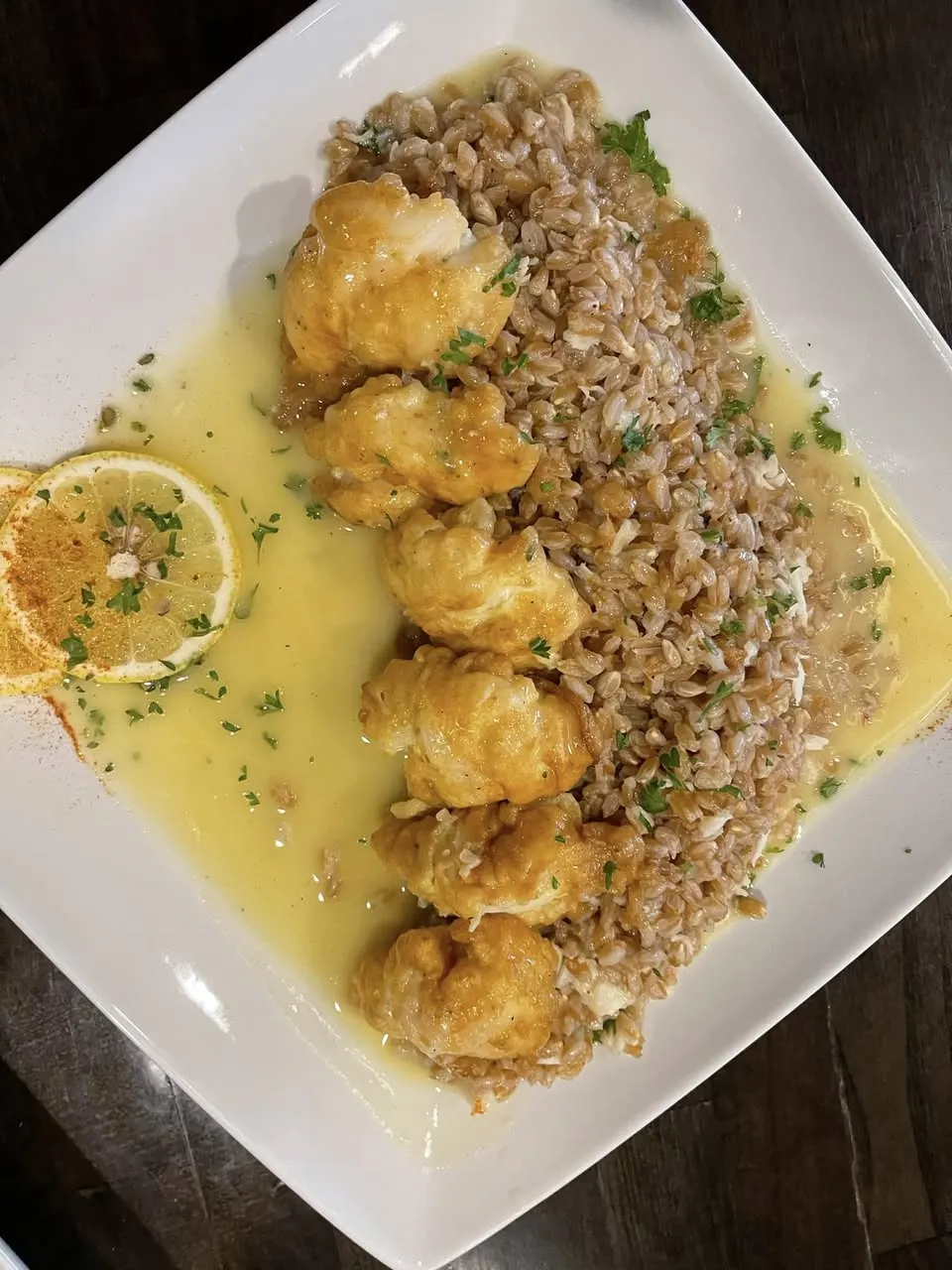 Fried shrimp over farro in a lemon butter sauce